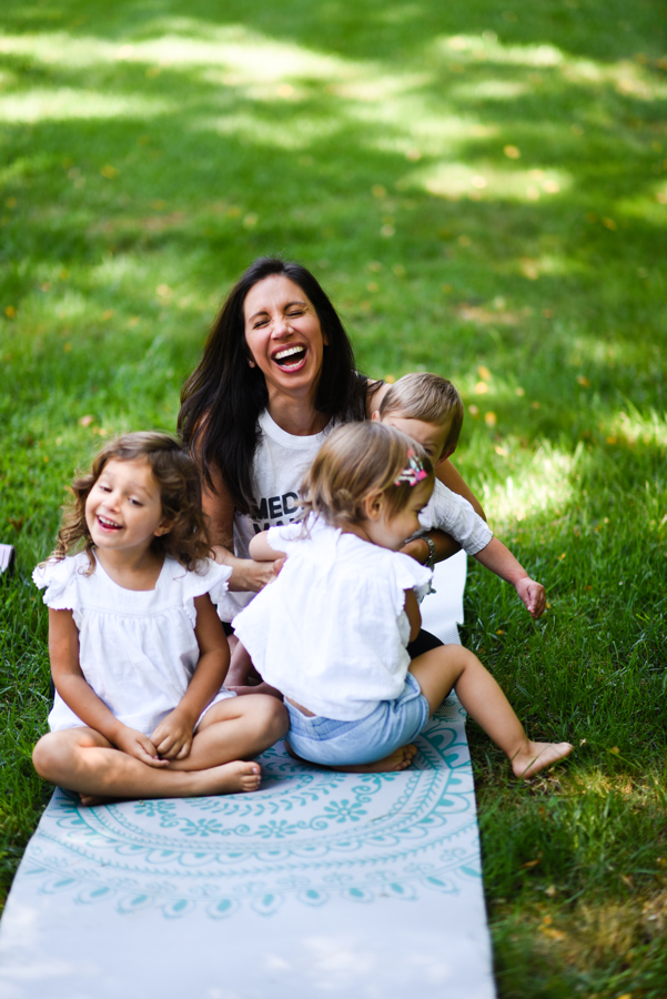 woman laughing hysterically with kids