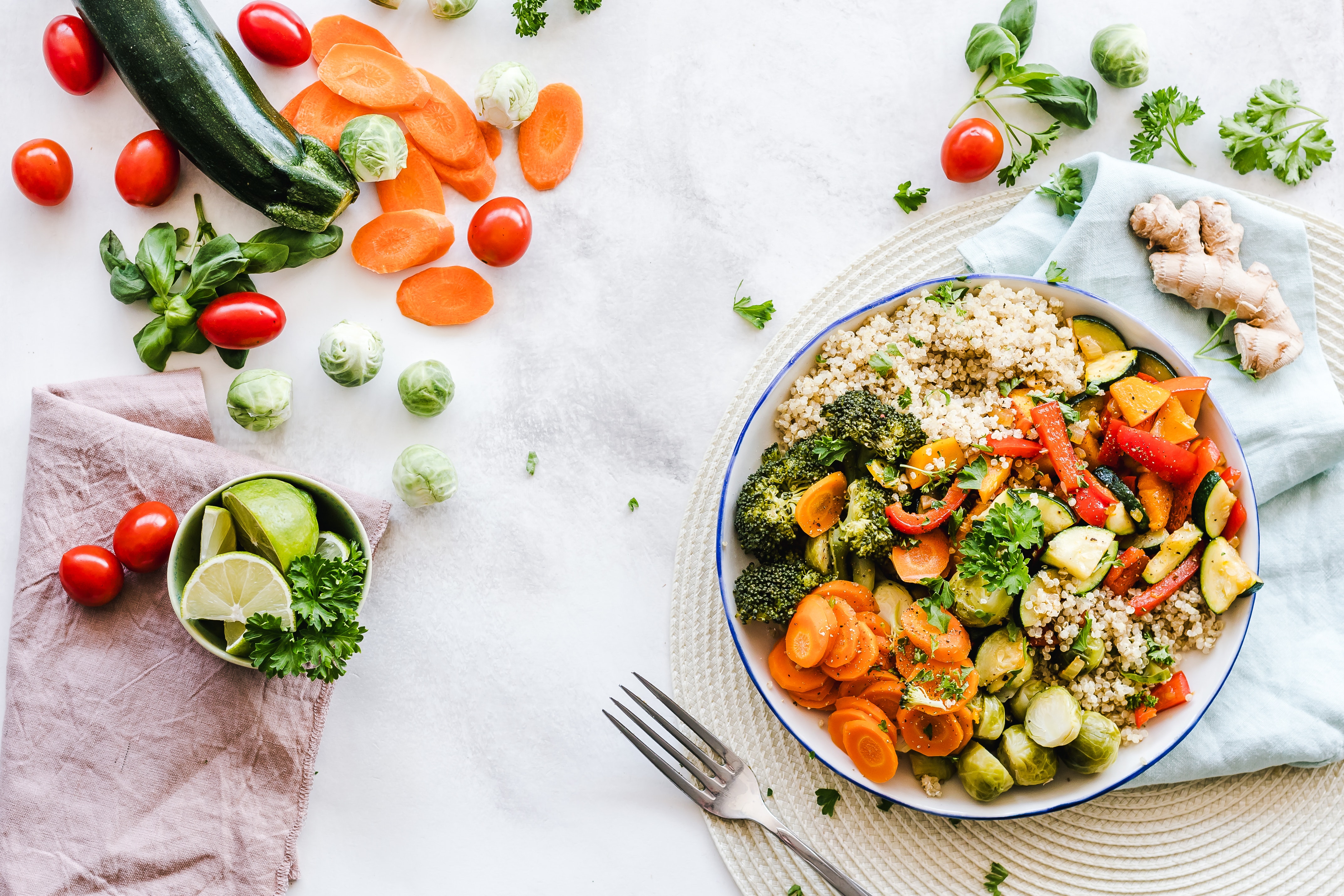 vegetable in a bowl and scattered on a table