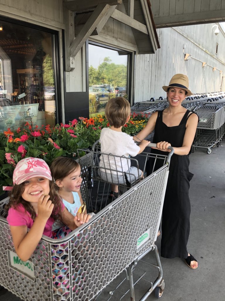 mom with kids in cart