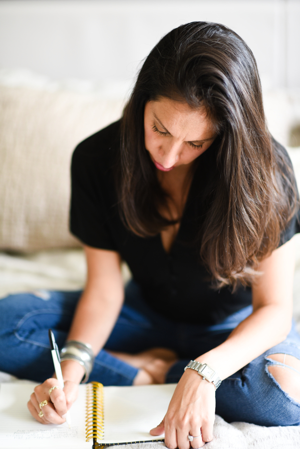 woman writing in her journal