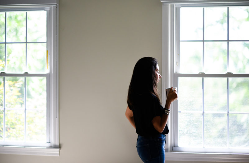 woman looking out of window