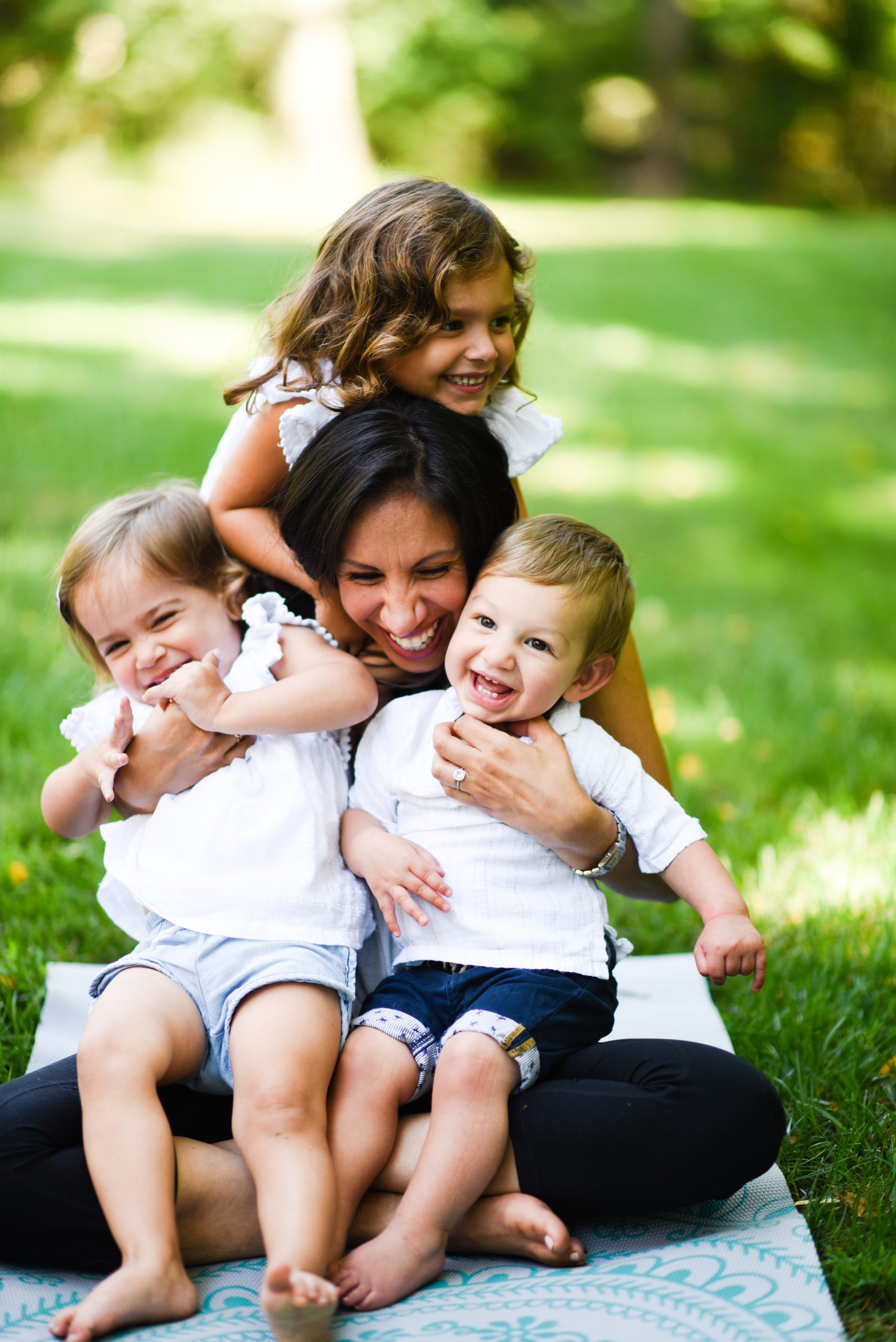 woman with 3 kids laughing